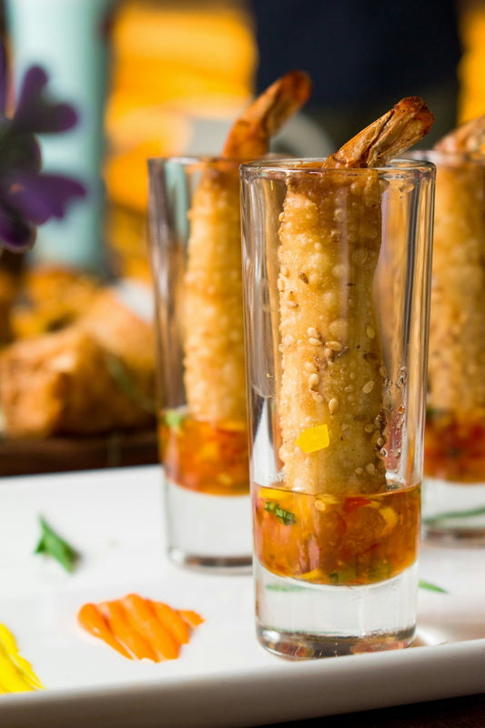 clear drinking glass with yellow liquid