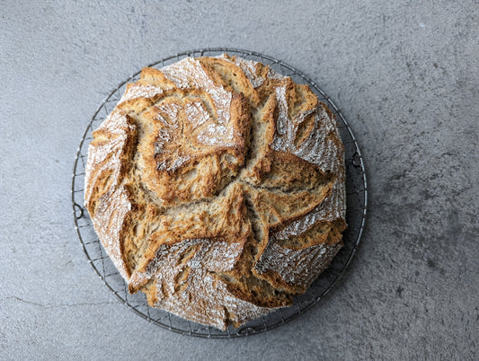 a loaf of bread sitting on top of a wire rack