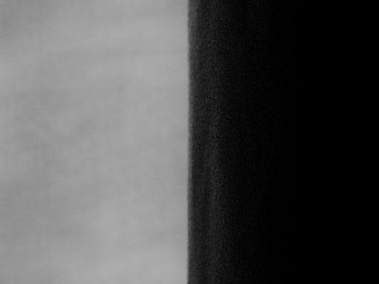 A split screen displays black and white contrast.